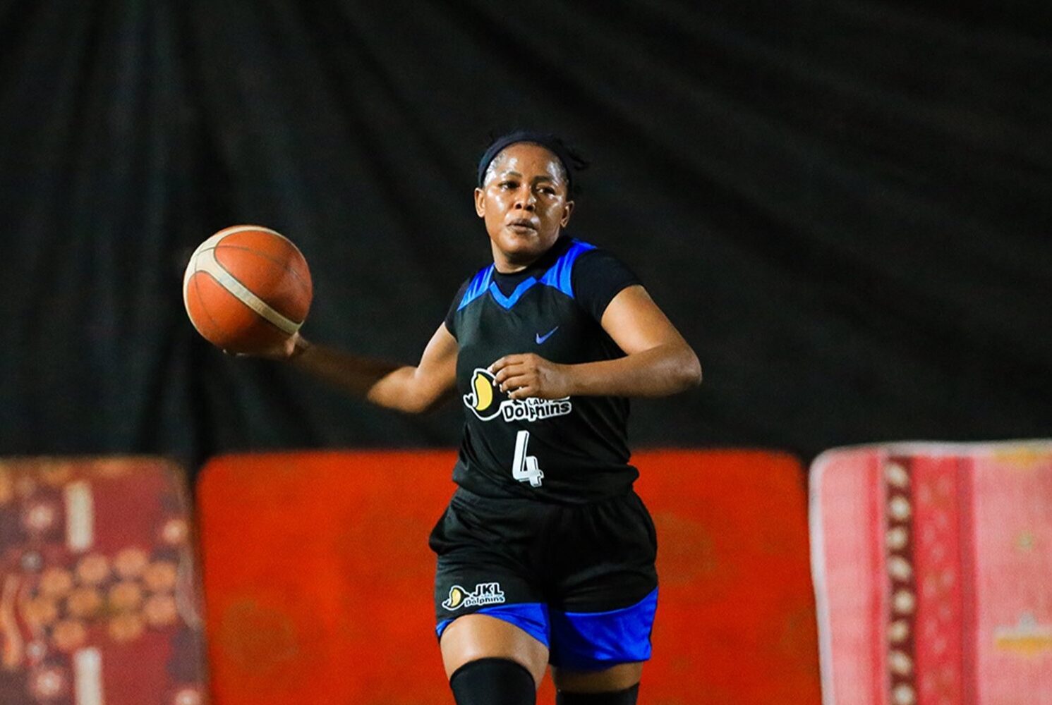 JKL Lady Dolphins player attacks the basket